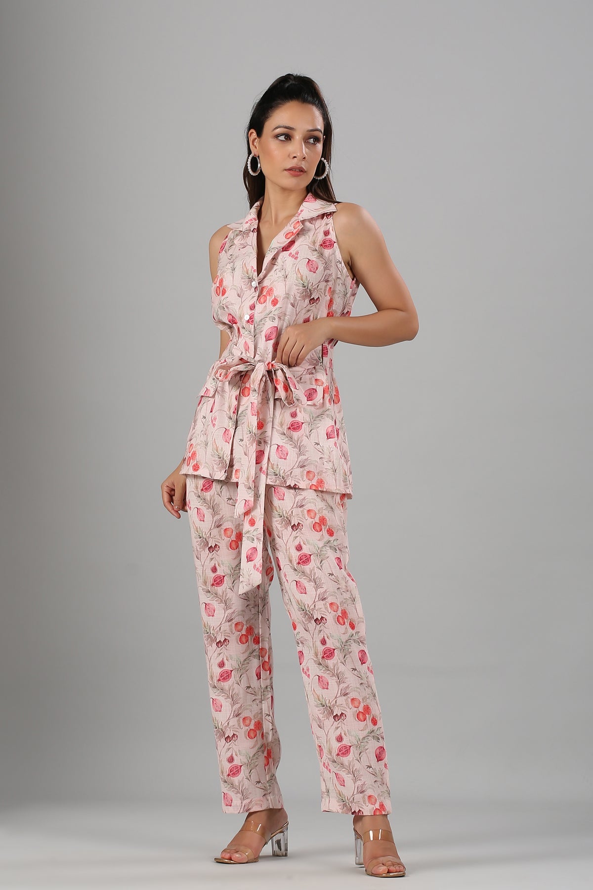 Floral printed two piece set for women with a belted top and relaxed fit pants in soft colors