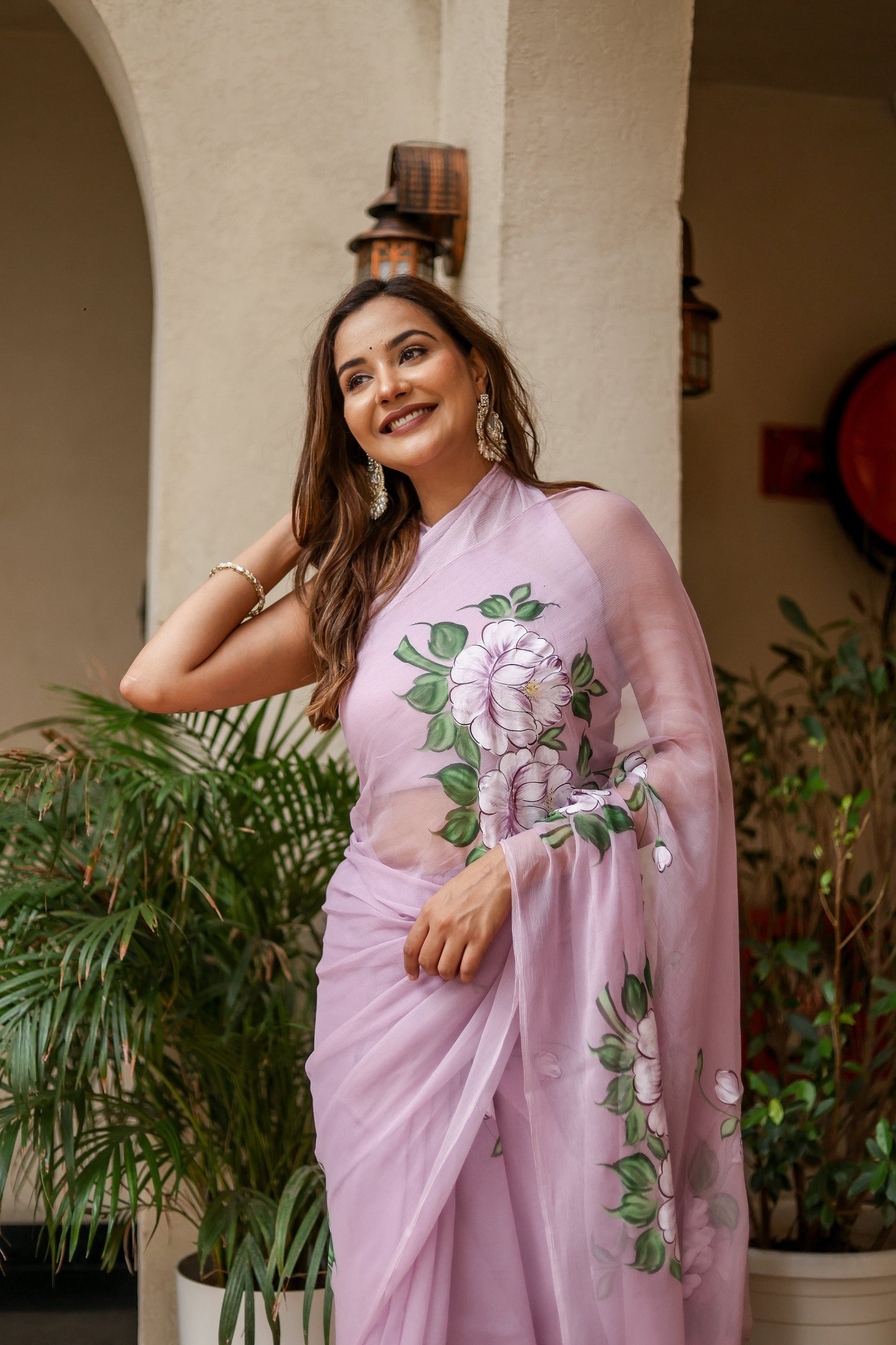 Elegant floral statement saree in lilac with vibrant floral designs, perfect for festive occasions