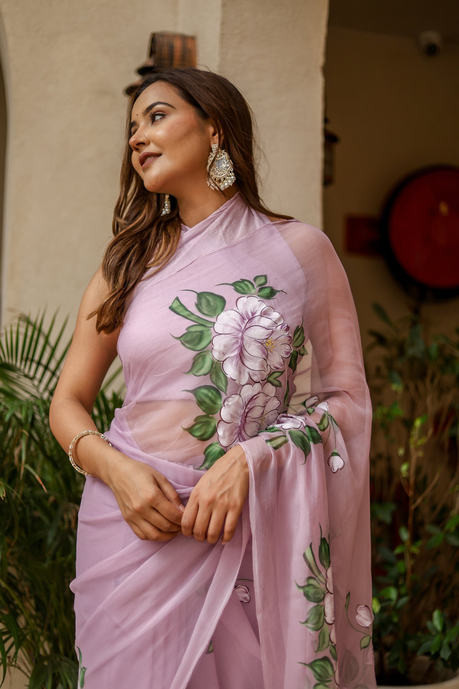 Elegant floral statement saree in light purple with intricate floral designs, ideal for festive occasions