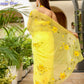 Elegantly draped floral viscose chiffon saree with mukaish work in bright yellow, perfect for festive occasions