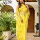 Elegant yellow floral viscose chiffon saree with mukaish work, perfect for festive occasions and parties