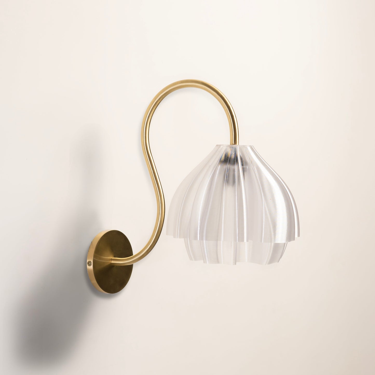 Sozori flower shaped wall light fixture with clear shade and brass arm for elegant home decor