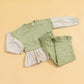 Stylera girls co-ord set featuring a green top with checkered sleeves and matching pants