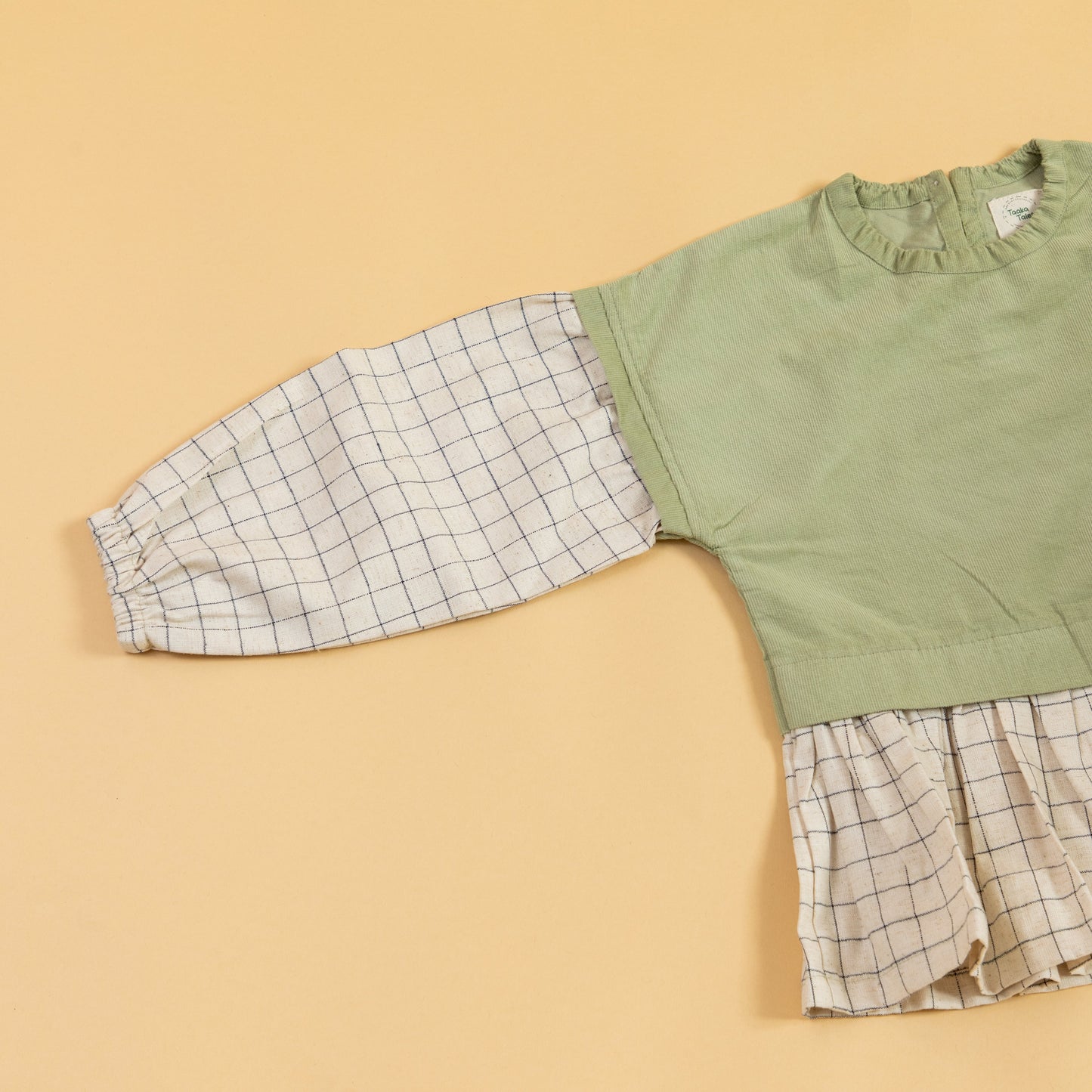 Stylera girls co-ord set featuring a green top with plaid sleeves for stylish outfits