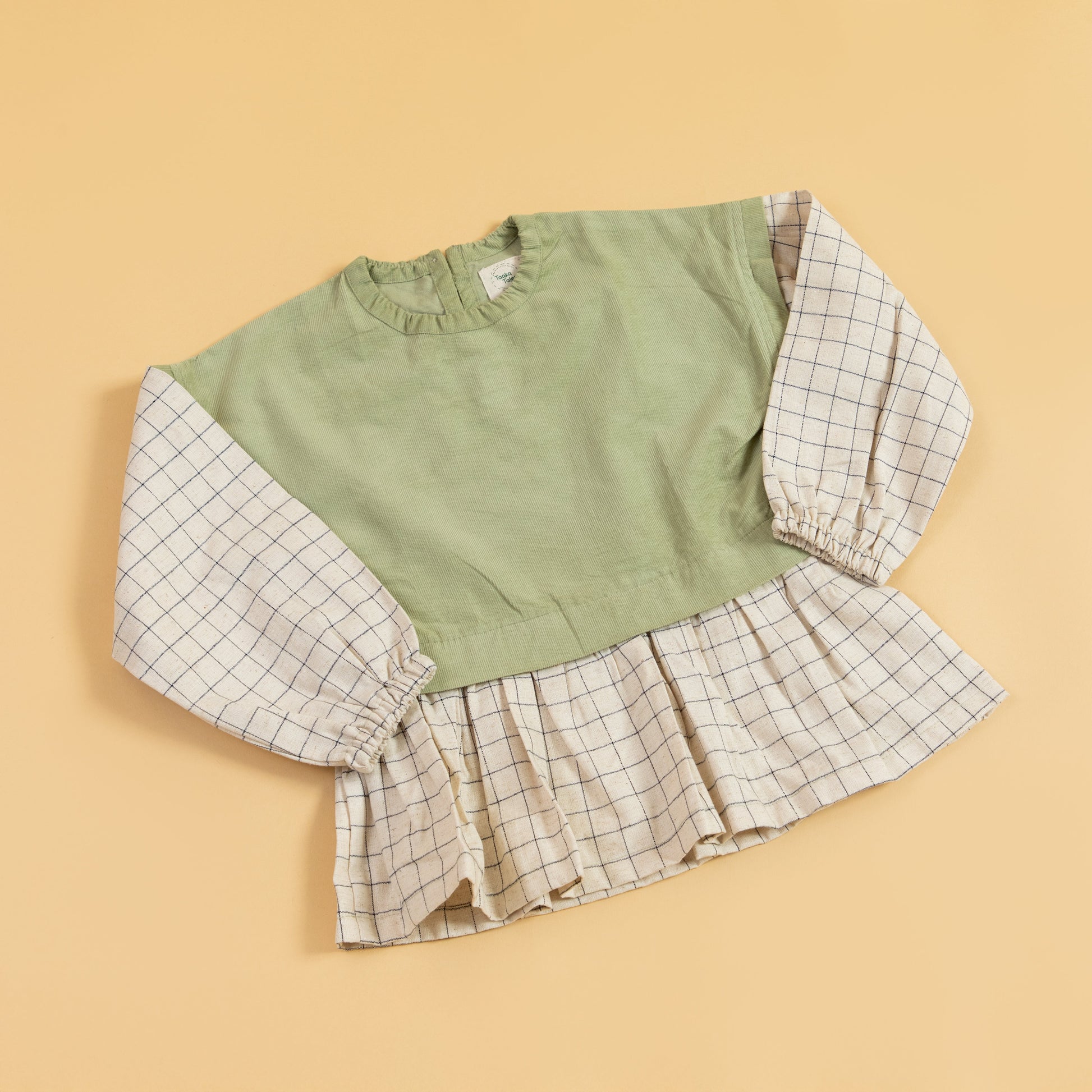 Stylera girls co-ord set featuring a green top with checkered puff sleeves and a ruffled hem