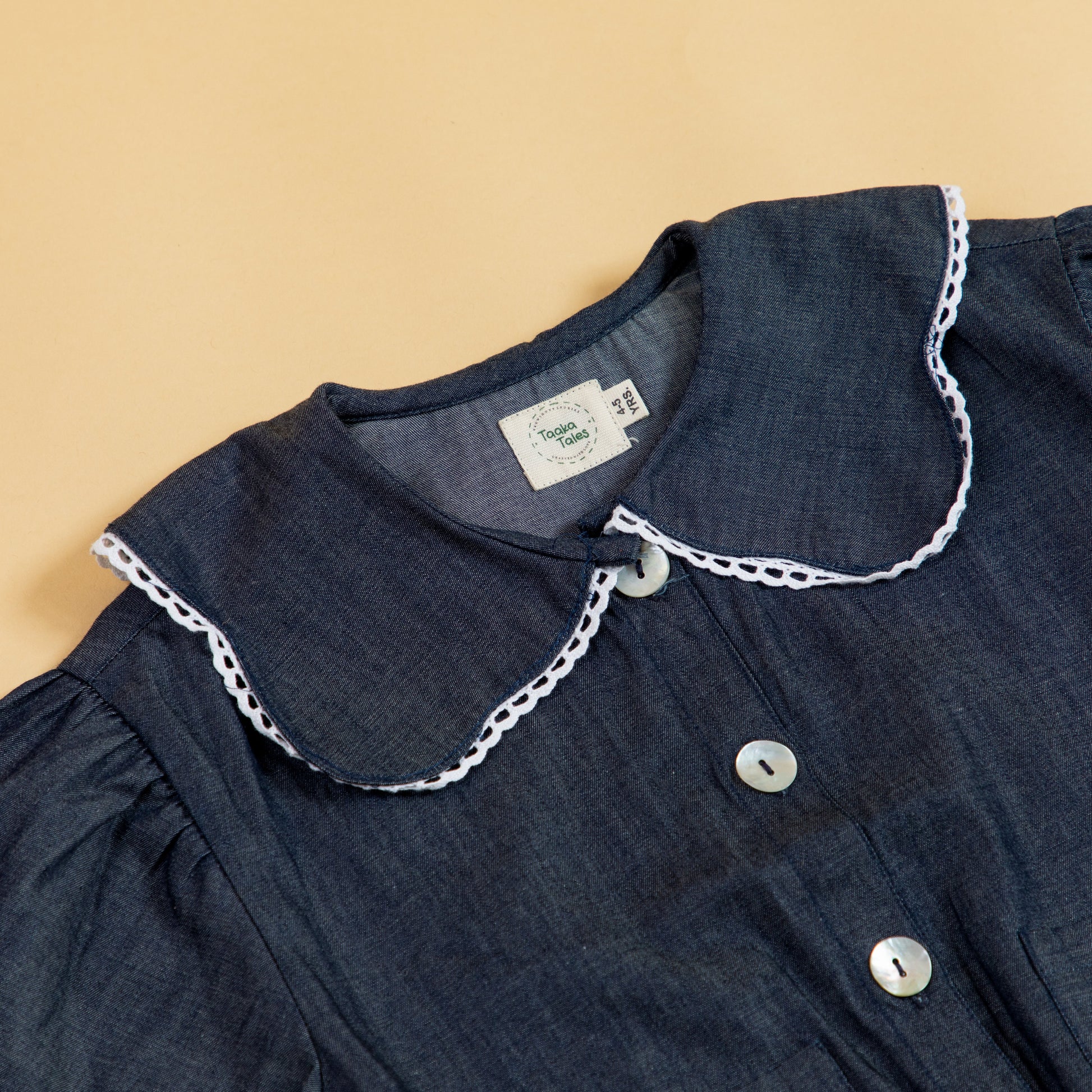 Stylera girls denim jacket with a stylish collar and playful design