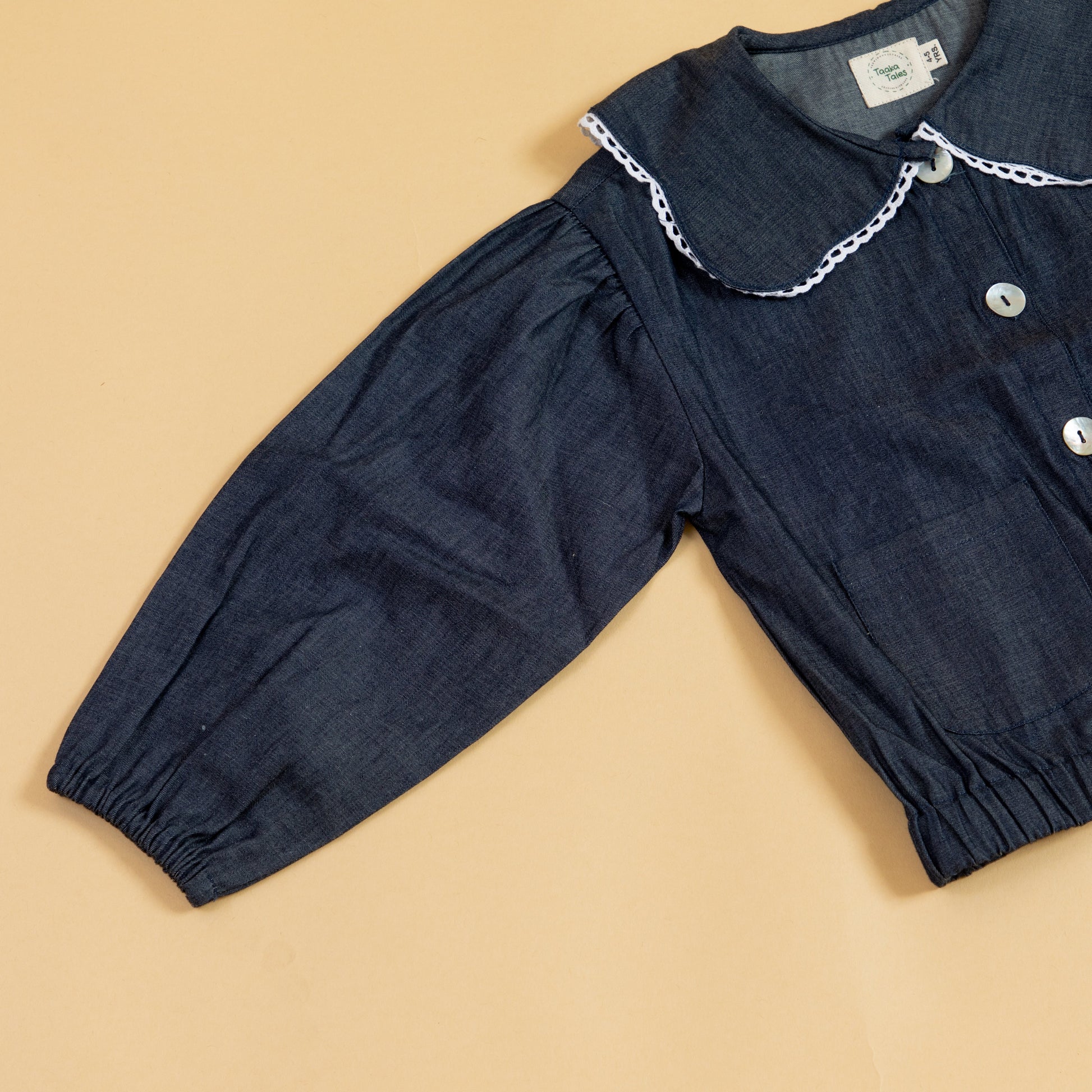 Girls denim jacket from Stylera with a stylish collar and button closure for trendy outfits