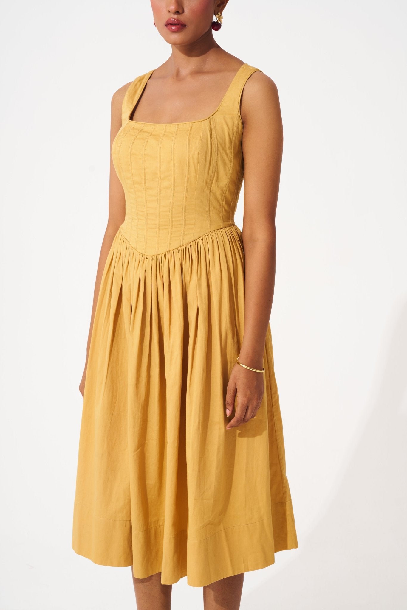 Stylera gold cotton corset dress with sleeveless design and gathered skirt
