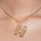 stylera gold letter N pendant necklace with textured beaded N and pearl accents on chain