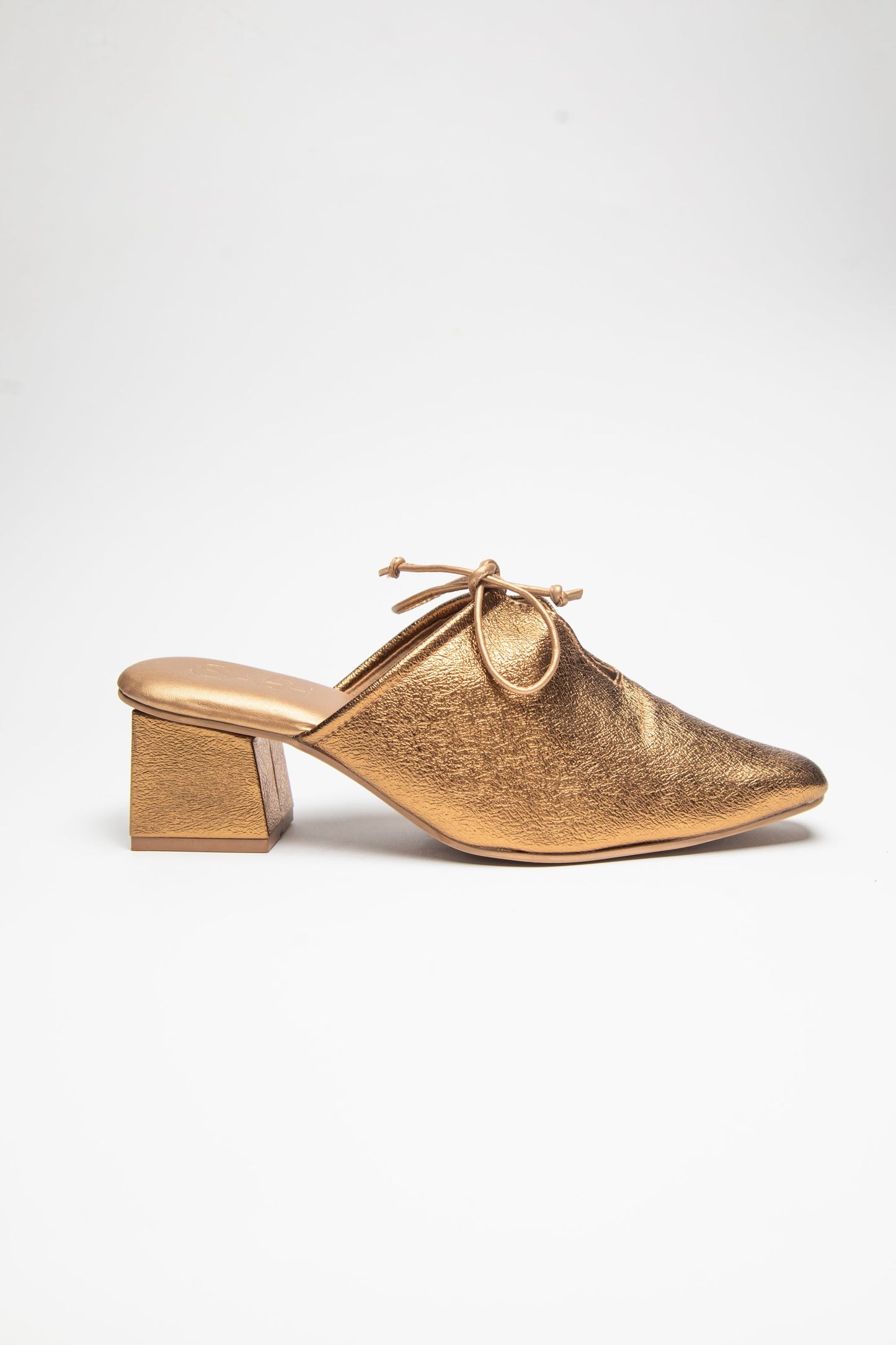 Stylera  trendy slip-on shoes for women in metallic gold with block heels and bow detail