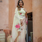 Elegant model wearing a Graceful Tints floral saree with pink roses and contrasting borders for special occasions