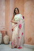 Model wearing a Graceful Tints floral saree featuring pastel shades and vibrant floral embroidery