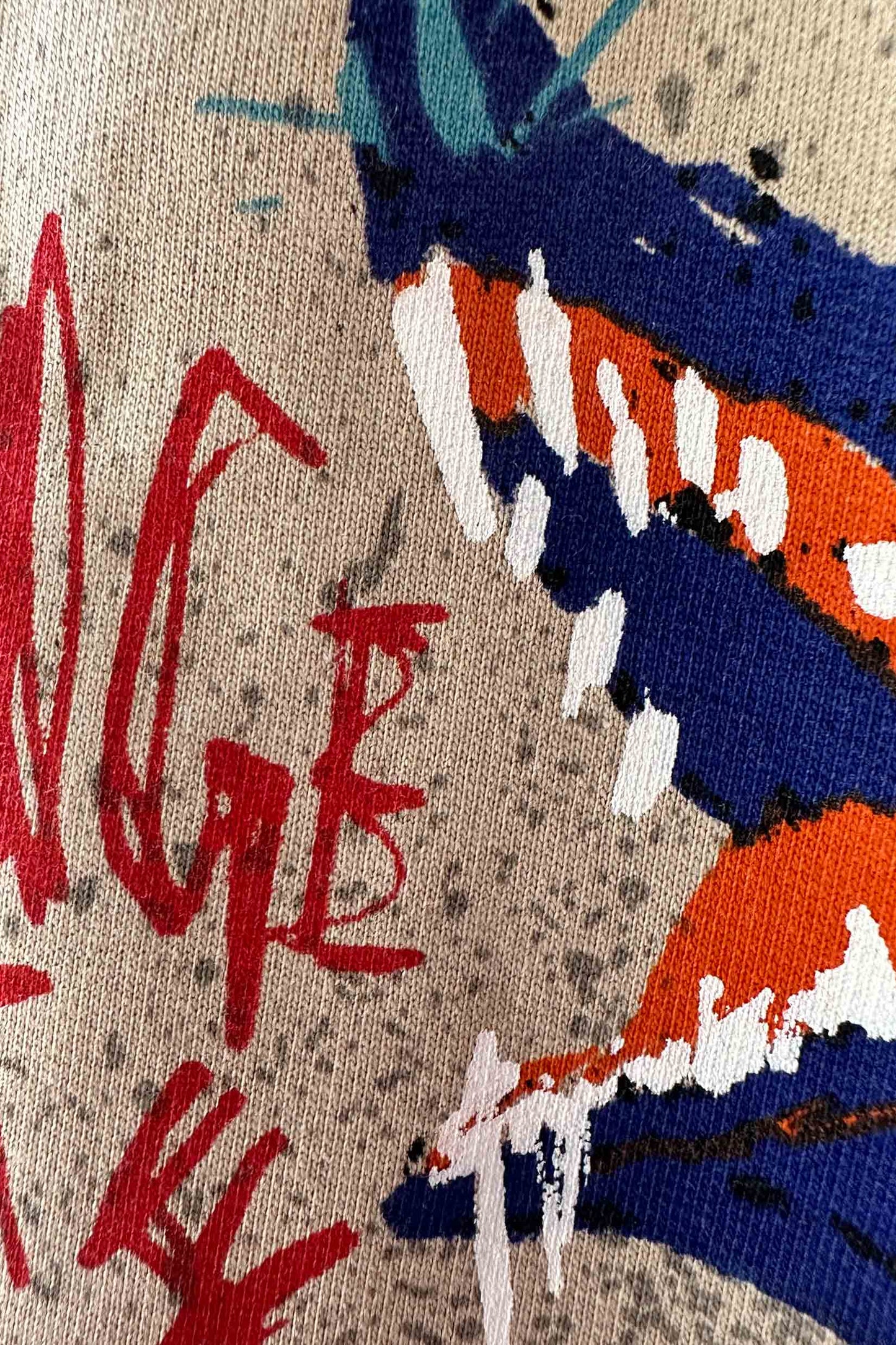 Stylera beige T shirt close up with colorful abstract red scribble blue and orange strokes graphic print oversized tee
