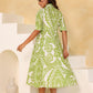 Stylera green boho summer dress with a flowy A-line shape and short sleeves