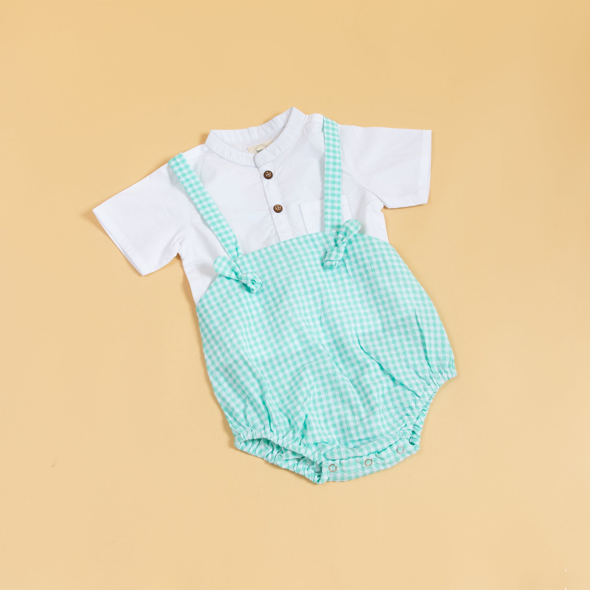 Adorable green gingham baby romper with short sleeves and button details for stylish infants