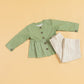 Green peplum outfit for women featuring a button-up top and striped trousers