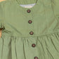 Green peplum outfit for women featuring stylish buttons and a comfortable fit