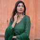 Elegant green three piece suit for women with intricate embroidery and matching dupatta by Stylera