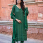Elegant green three piece suit for women featuring detailed embroidery and matching dupatta