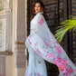 Elegant Stylera handcrafted saree with floral print displayed in a beautiful setting