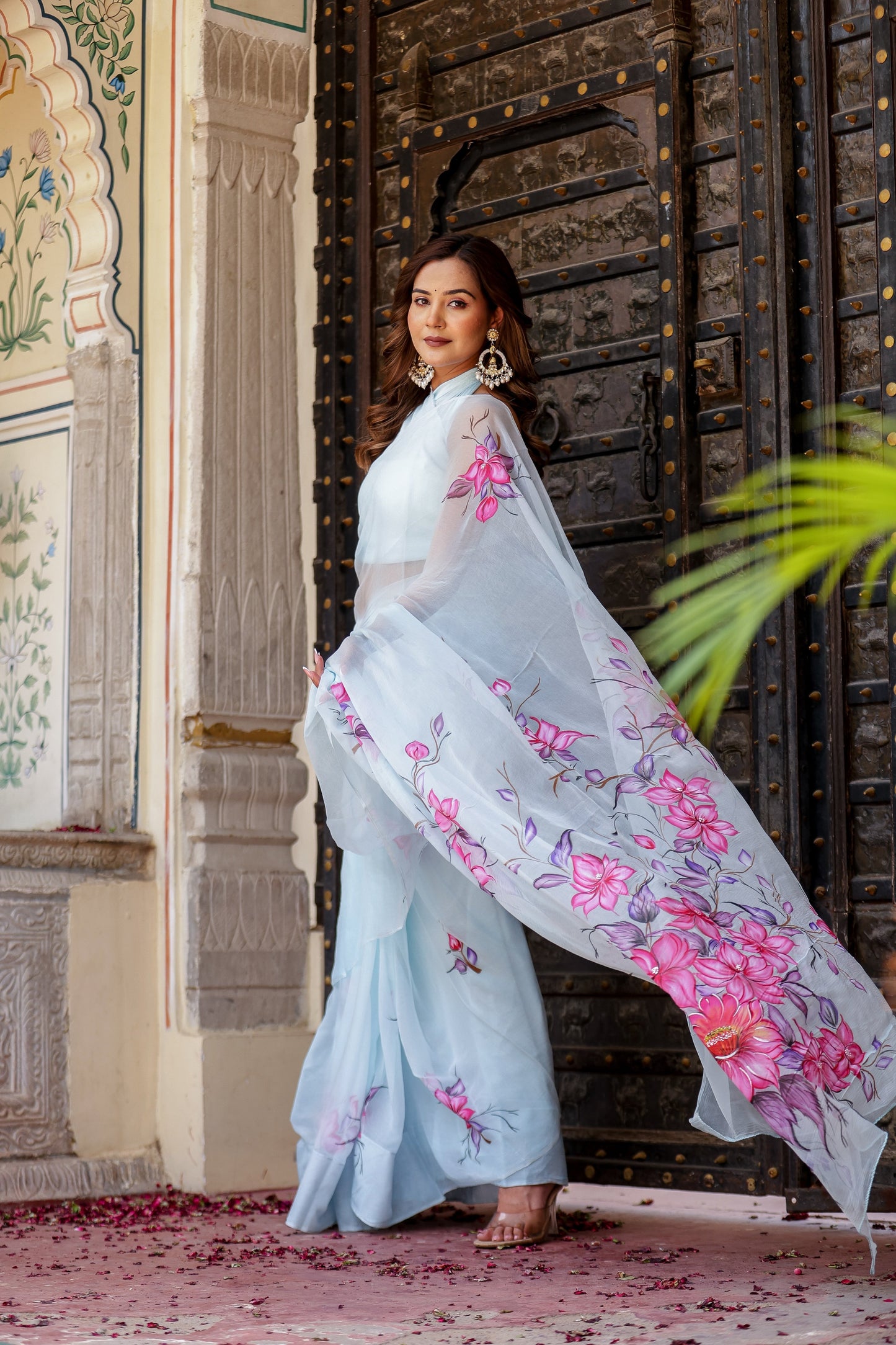 Elegant Stylera handcrafted saree with floral print displayed in a beautiful setting