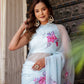 Elegant Stylera handcrafted saree with floral print in light blue, perfect for special occasions
