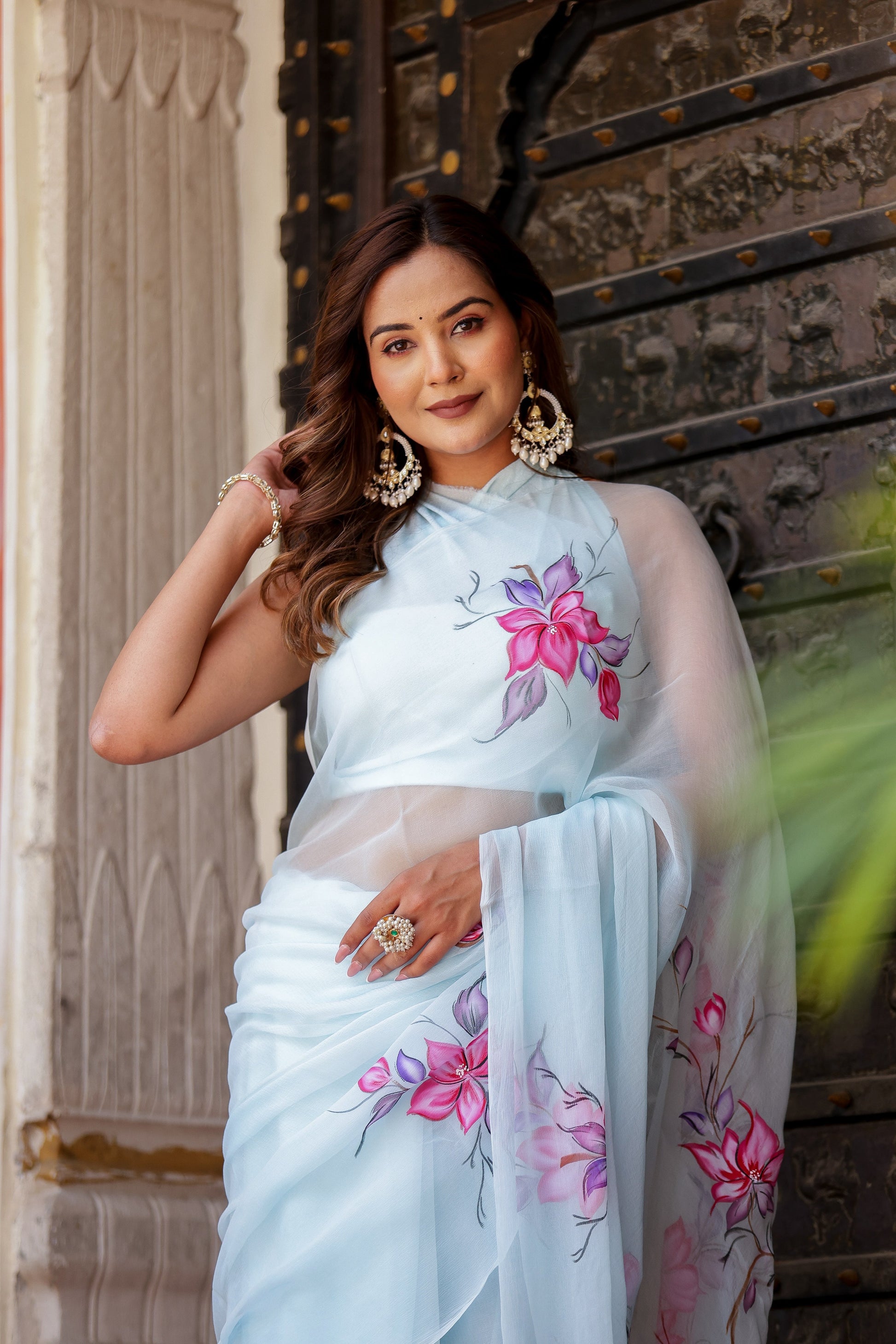 Elegant Stylera handcrafted saree with floral print in light blue, perfect for special occasions