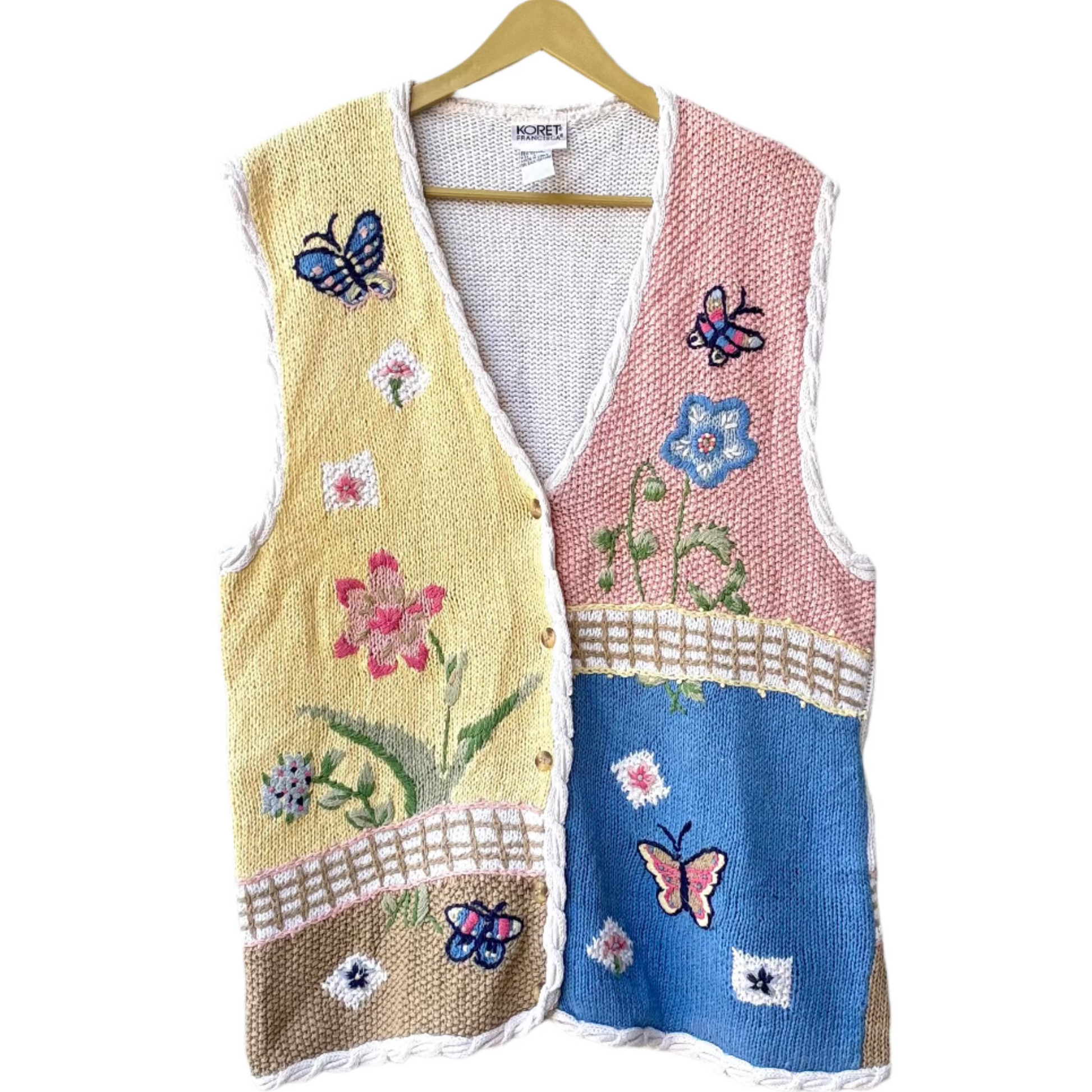 colorful knit vest for women patchwork pastel panels with embroidered flowers and butterflies and braided trim