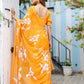 Elegant handpainted chiffon saree in bright orange with floral designs for festive occasions