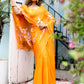 Beautiful handpainted chiffon saree in vibrant orange, perfect for festive occasions