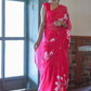 Elegant handpainted chiffon saree rani pink featuring floral designs for festive occasions