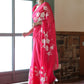 Elegant model wearing a handpainted chiffon saree rani pink with floral designs, showcasing grace and style.