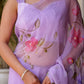 Elegant handpainted lavender chiffon saree featuring floral designs and a lightweight fabric