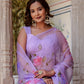 Elegant model wearing a handpainted lavender chiffon saree with floral designs and matching accessories