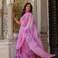 Elegant model showcasing a handpainted lavender chiffon saree with floral designs in a traditional setting