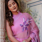 Elegant handpainted lavender chiffon saree with floral designs, worn by a model in a serene setting