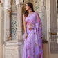 Elegant handpainted lavender chiffon saree with vibrant floral designs for festive occasions