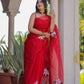 Elegant handpainted red organza saree adorned with floral motifs, perfect for festive occasions