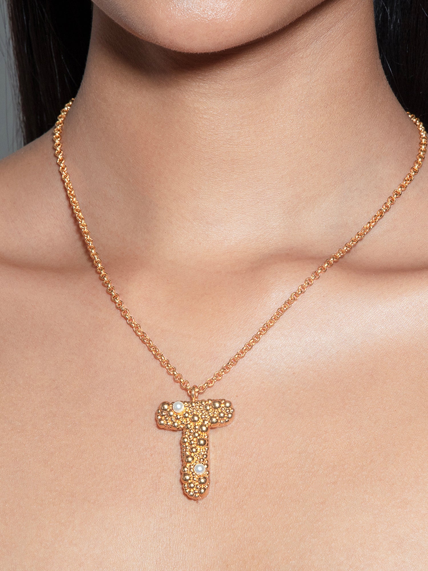 Stylera gold letter T pendant necklace with crystal and pearl embellishments on chain
