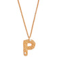 Stylera gold letter P pendant necklace with textured filigree P charm and two small white stones on gold chain