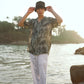 Khajuraho print men’s oversized shirt by Stylera worn by a model near the water