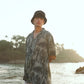 Khajuraho print men’s oversized shirt by Stylera in an outdoor beach setting