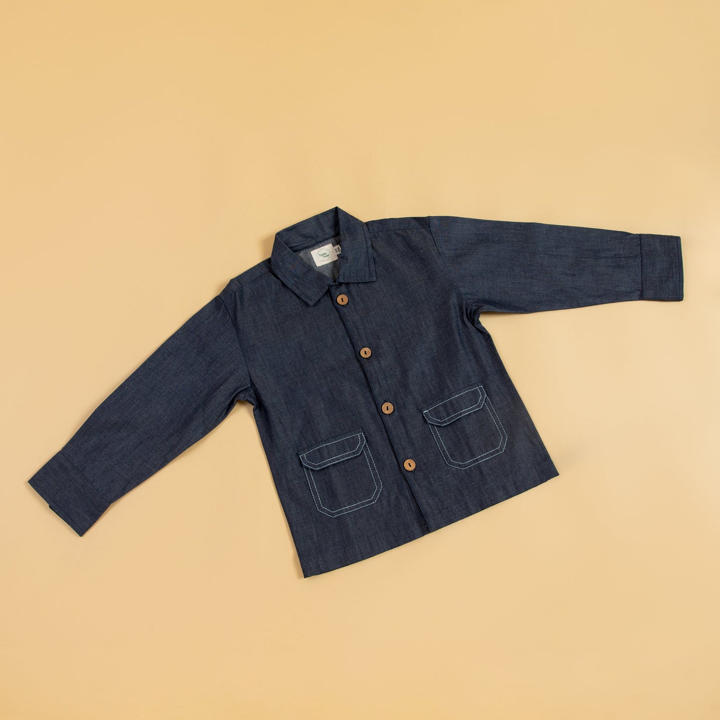 Kids blue denim jacket with button closure and front pockets for stylish comfort