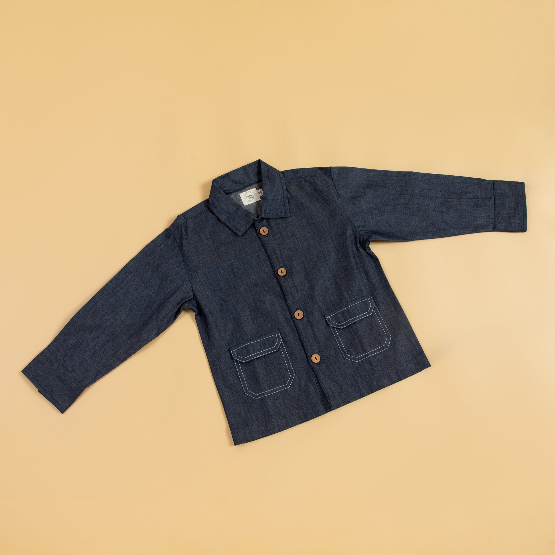 Kids blue denim jacket with button closure and front pockets for stylish comfort
