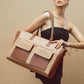Stylish oversized tote bag in brown and beige, featuring a large tote purse with laptop compartment.