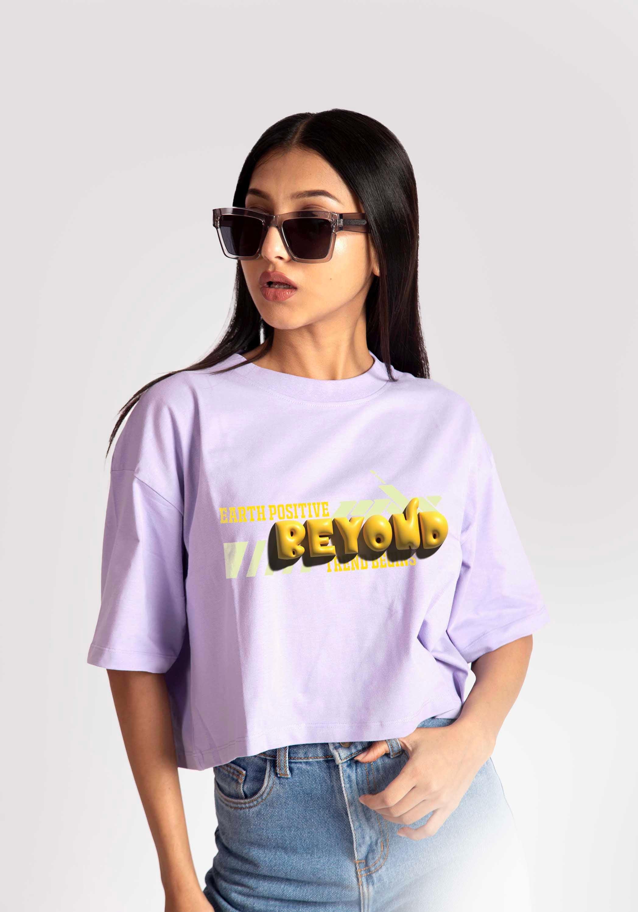 Stylera  lavender oversized crop top with graphic print worn by woman in sunglasses