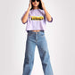 Stylera lavender oversized crop top worn by model with blue jeans and sunglasses