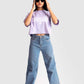 Stylera lavender oversized crop top worn by model with casual blue jeans and sunglasses