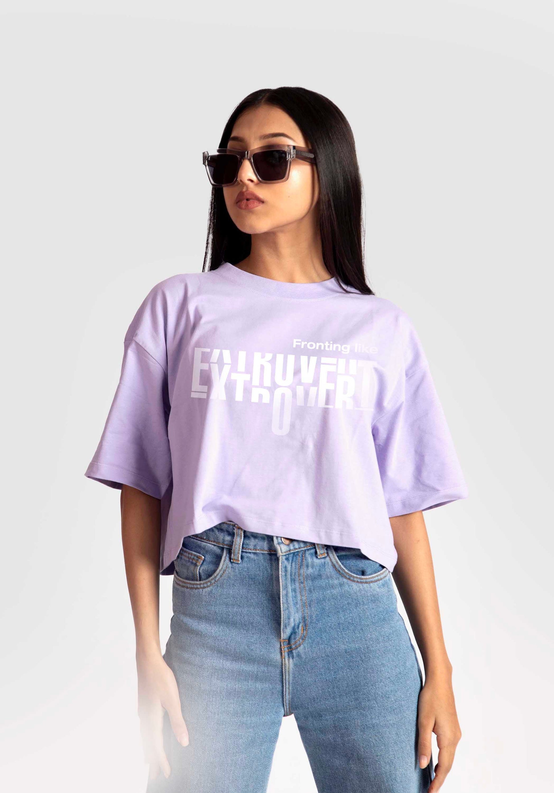 Stylera lavender oversized crop top with white graphic print worn with blue jeans