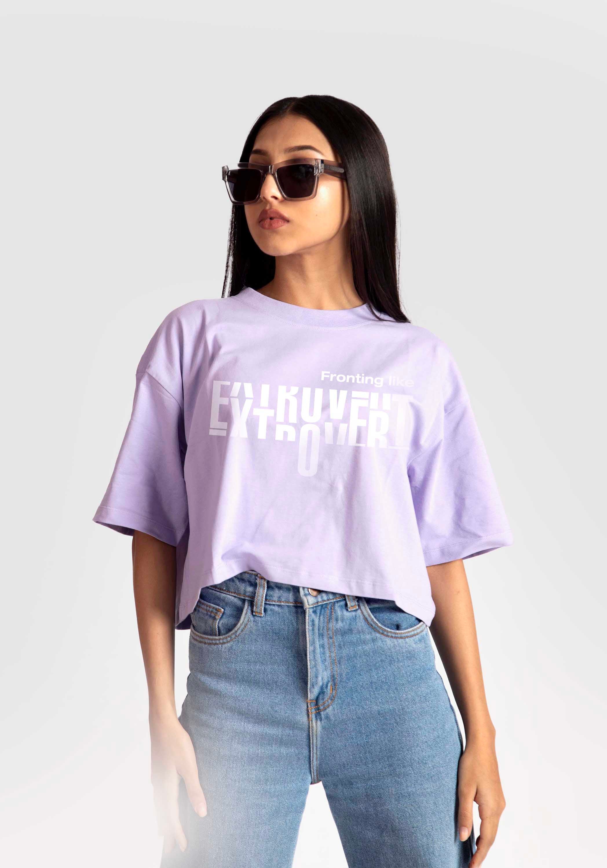 Stylera lavender oversized crop top with white graphic print worn with blue jeans